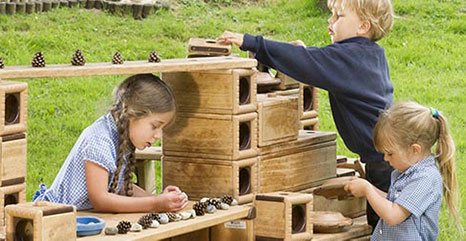 children playing with natural loose parts