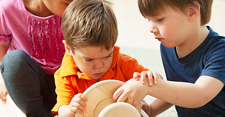 Children fighting over a toy