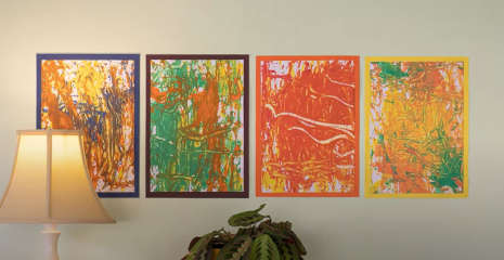 Four acorn marble paintings mounted on a wall