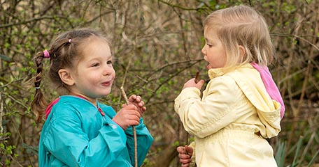 two small children playing outside