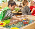 Children playing at a Sand and Water table