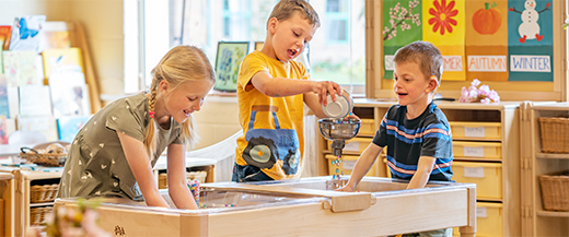 Children playing with water and beads