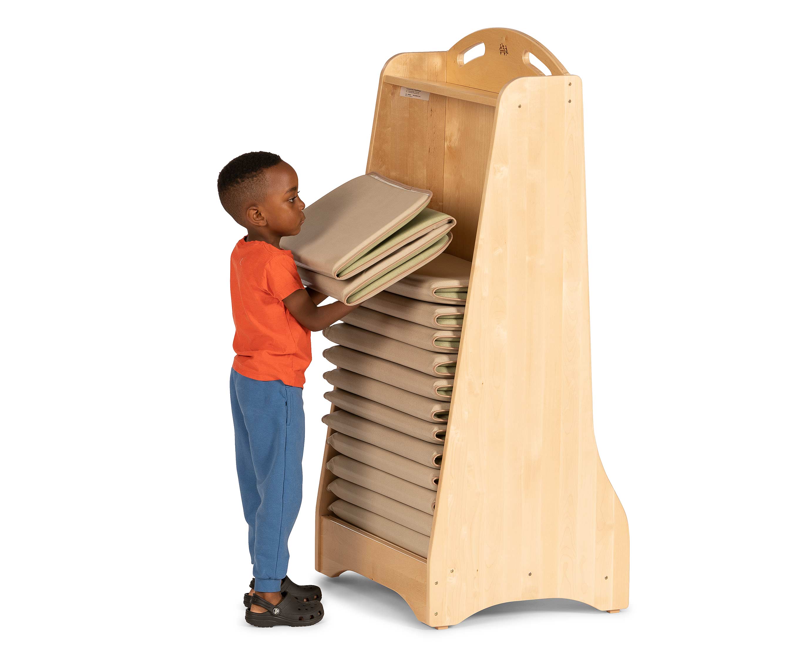 A boy stacking mats on the Restmat stacker