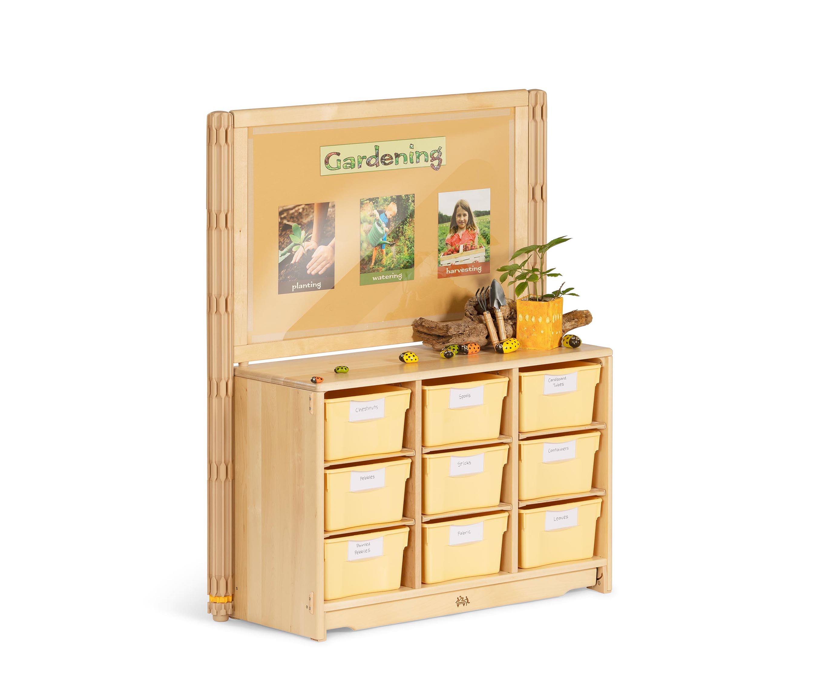 Gardening tools and pictures displayed on shelf top