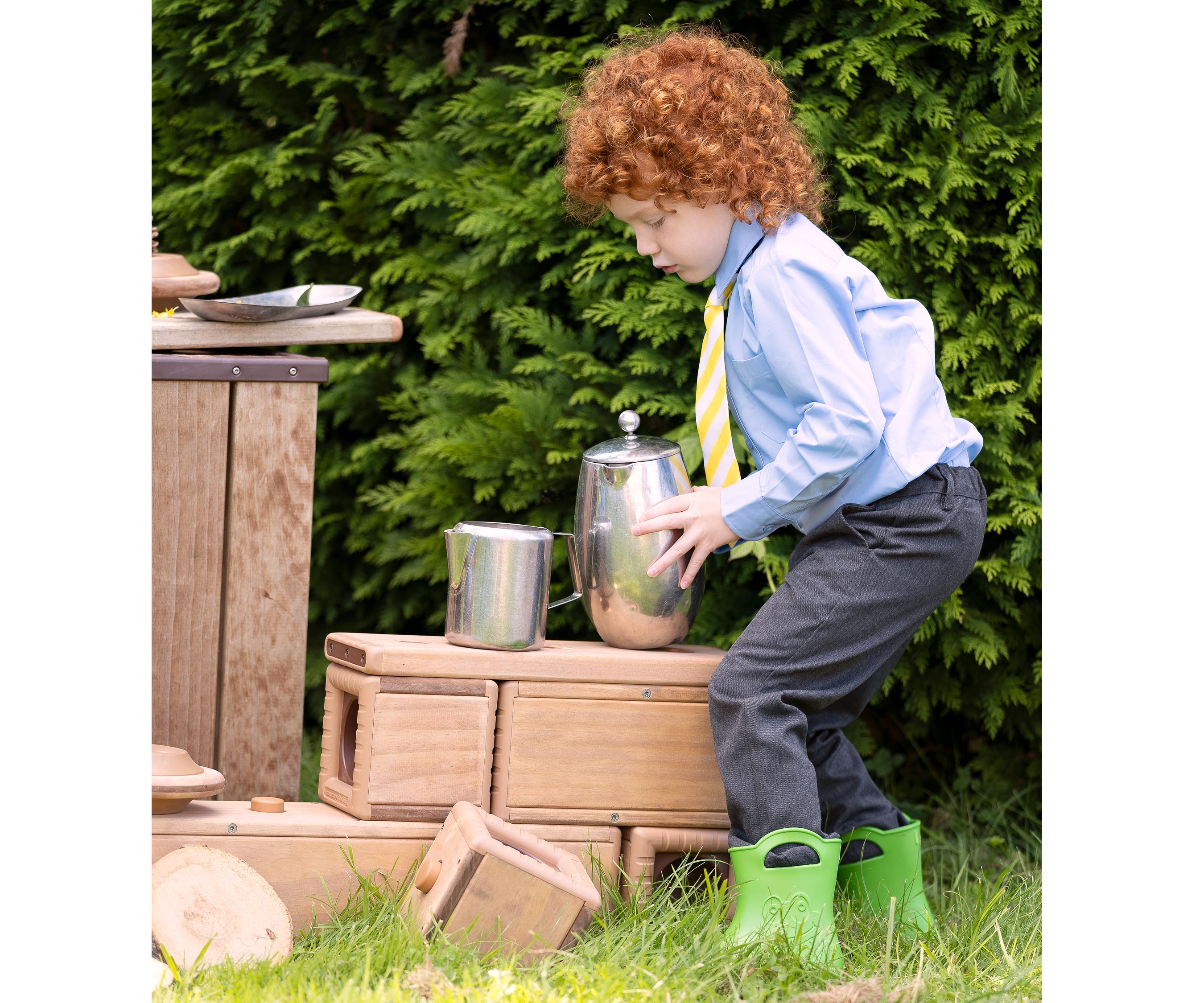 little boy with a kettle