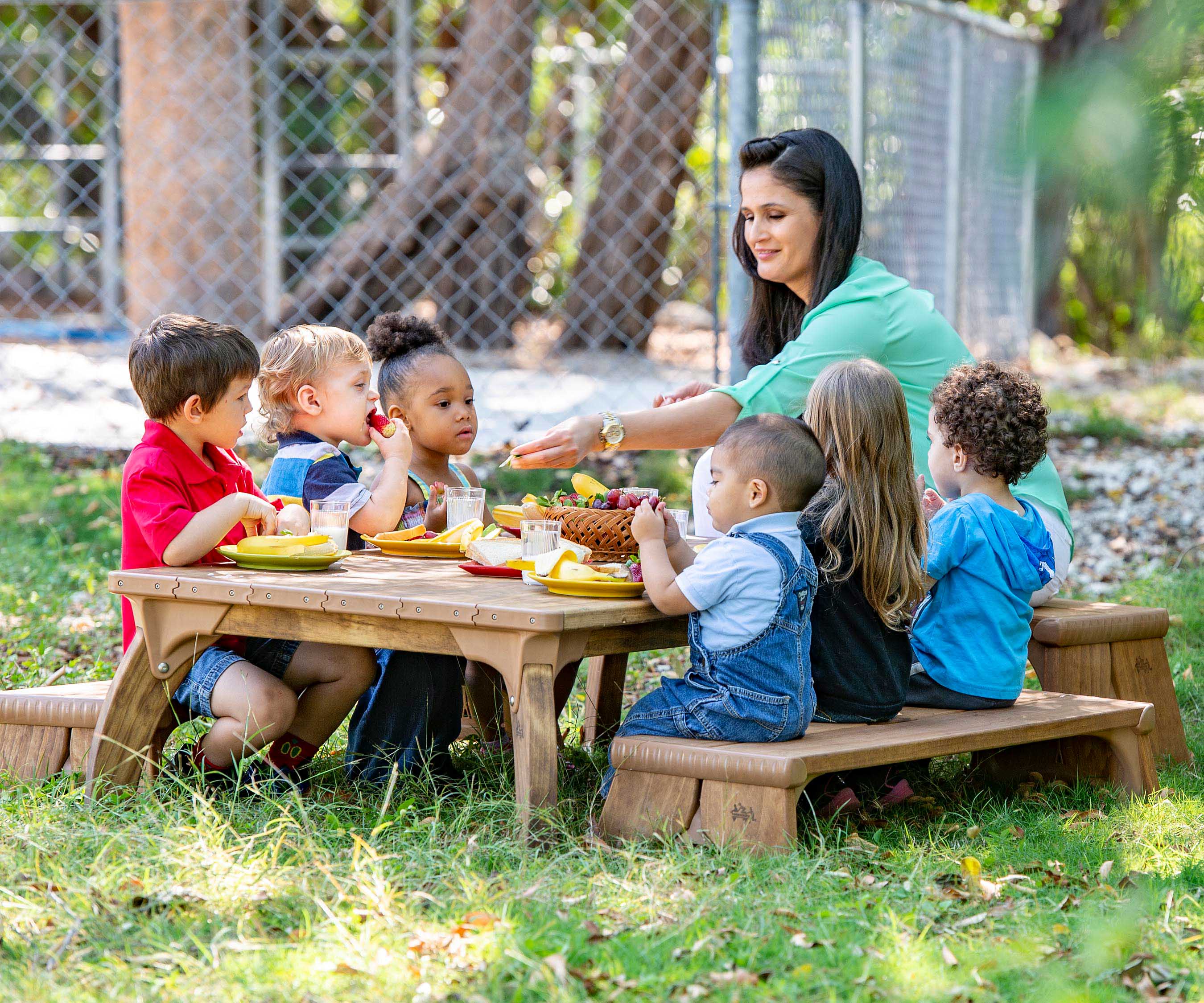 Children sitting at an Outlast table