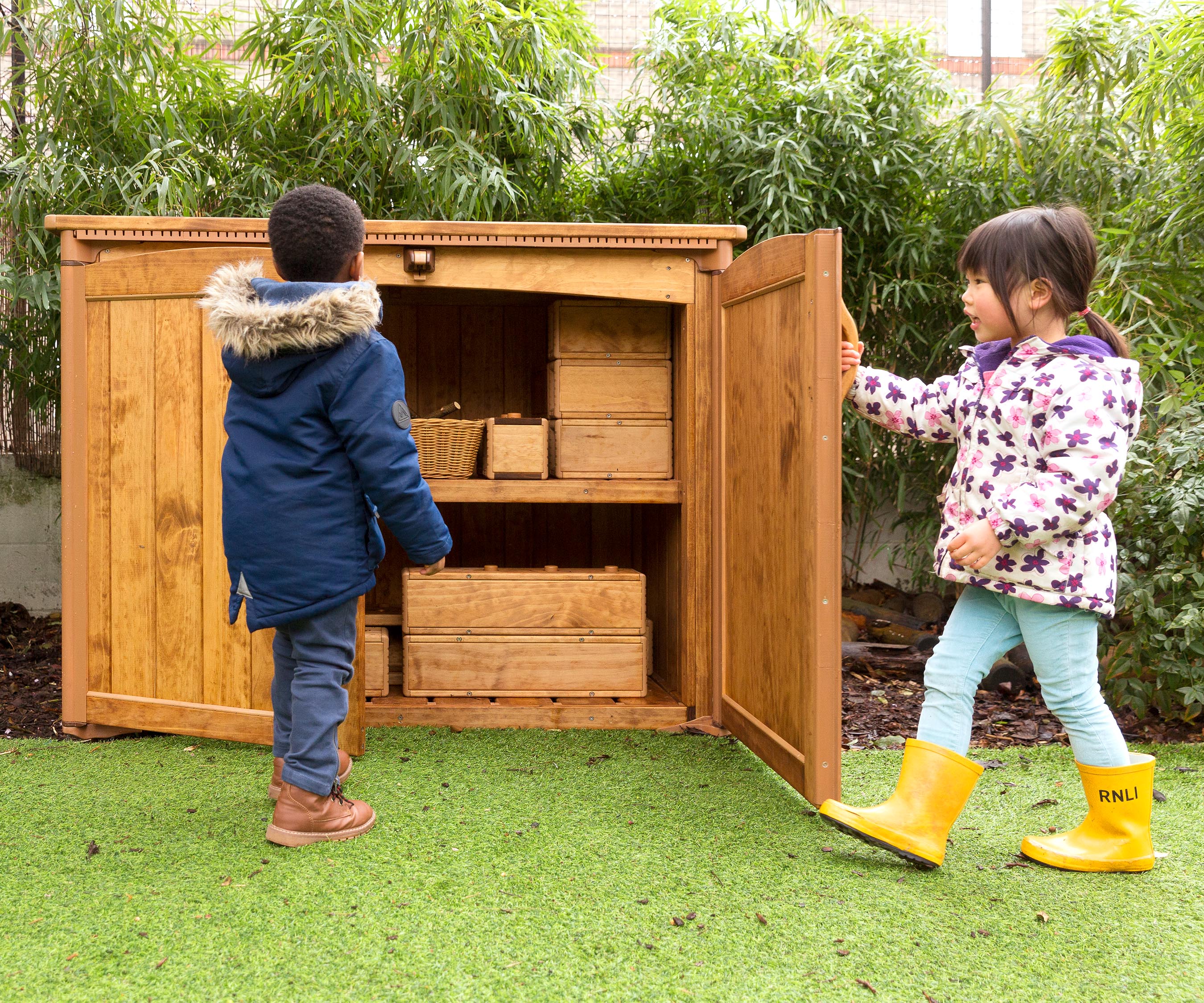 A boy and girl opening the Outlast storage unit.