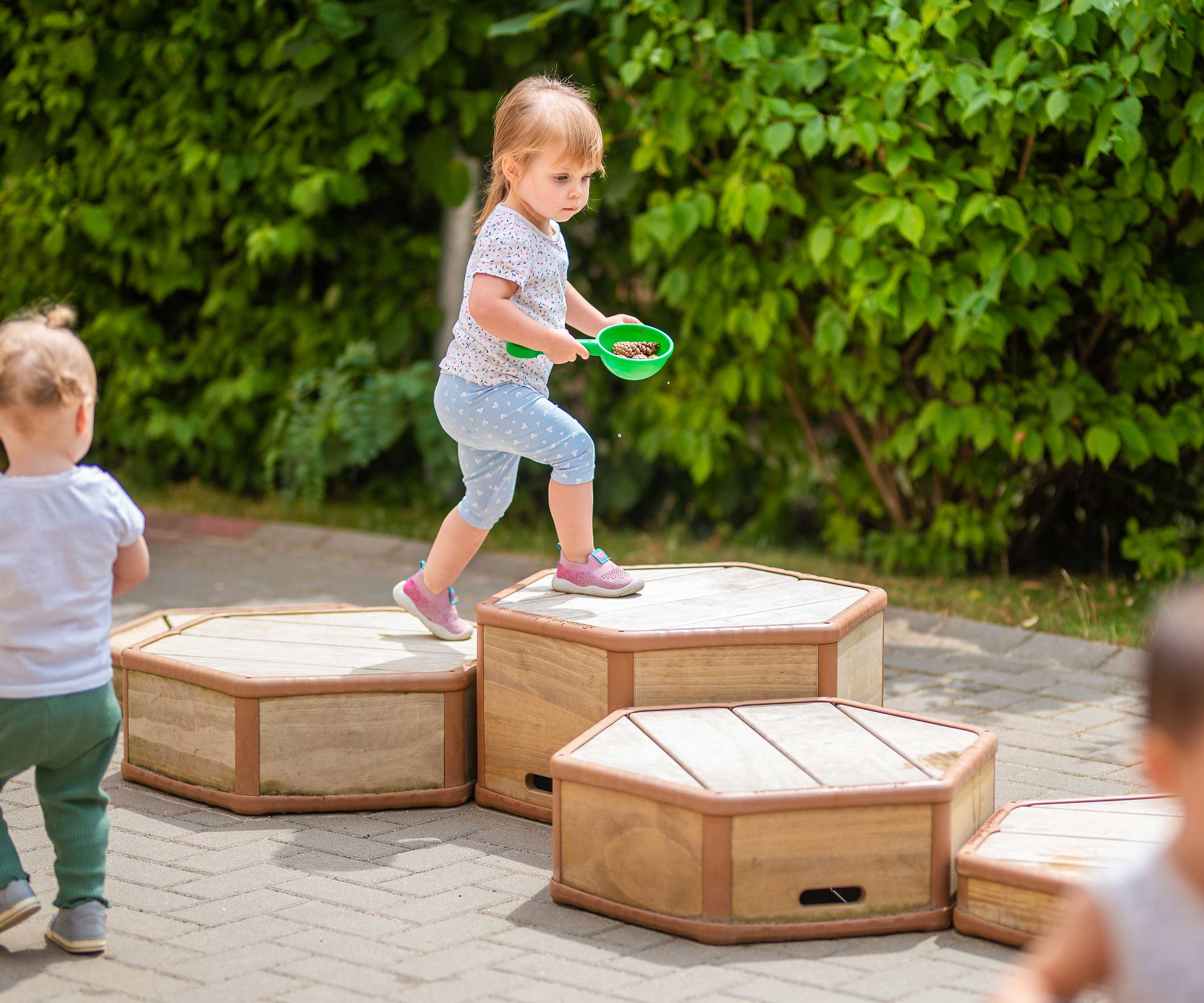 Girl on toddler risers