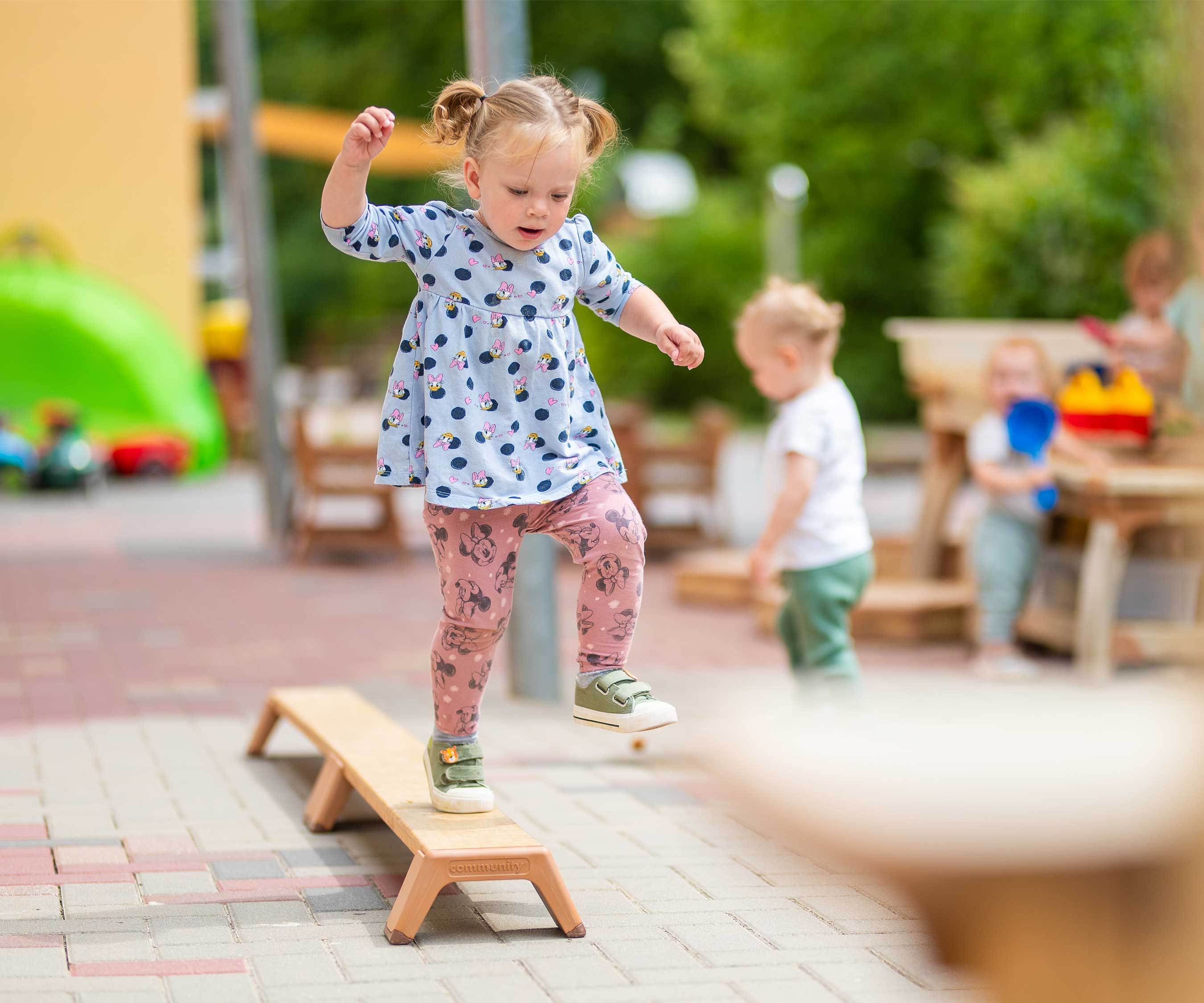 Girl on balancing beam