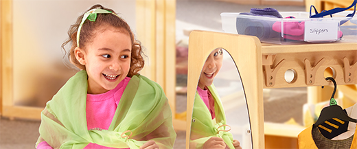 Children try on costumes at the Drama centre