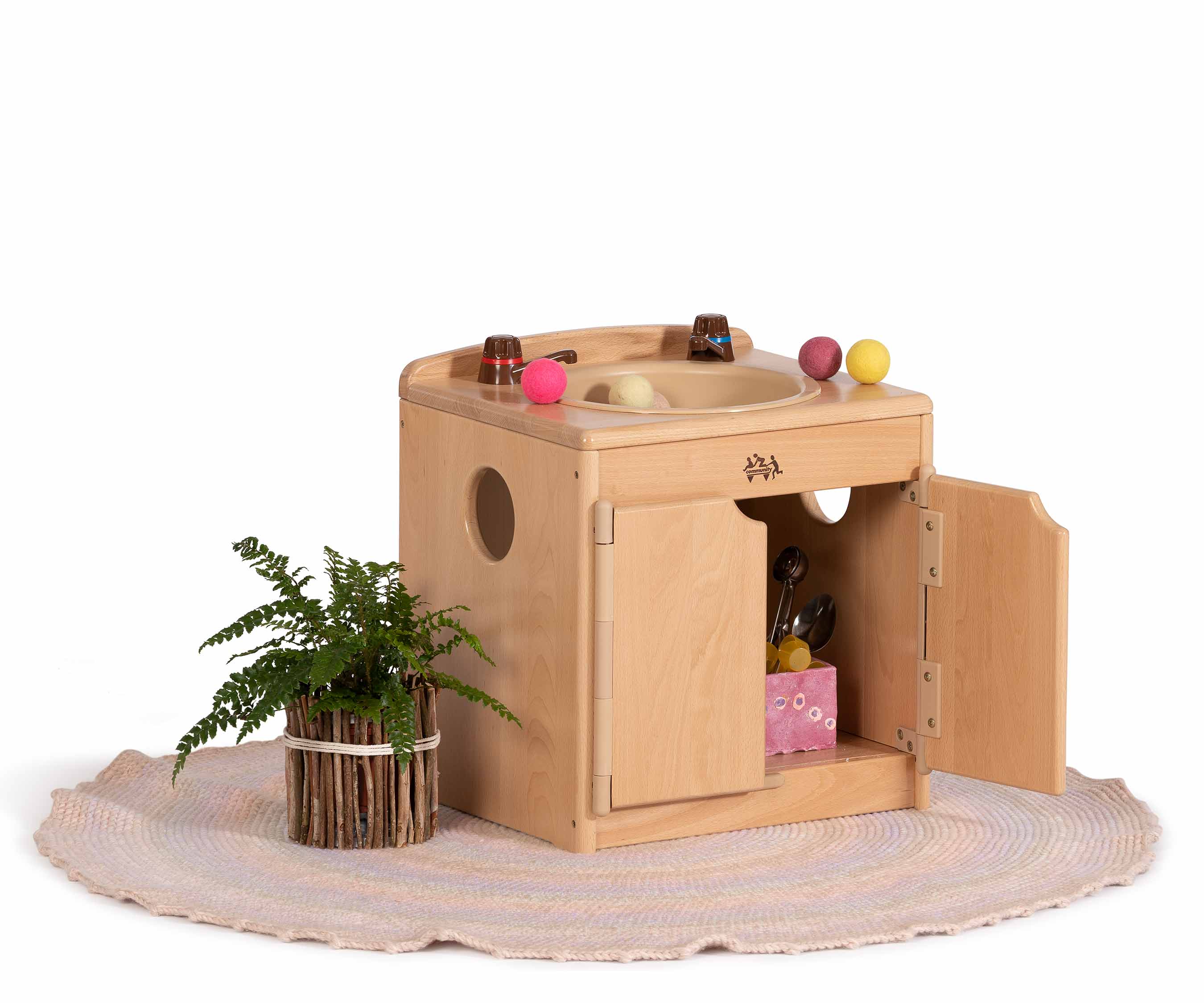 Low sink with rug and toys